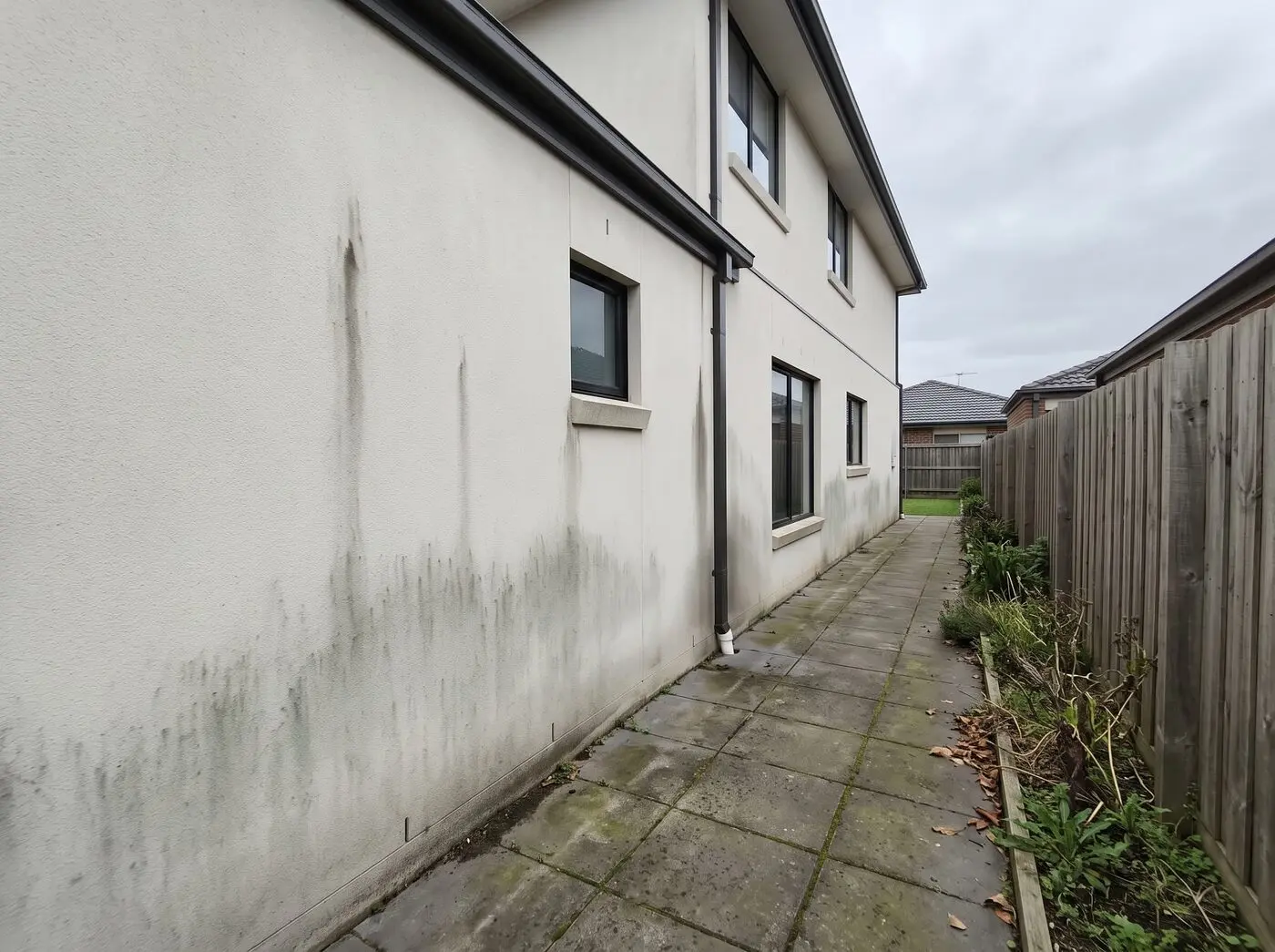 Rendered wall before cleaning in Melbourne south-east
